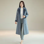 Angled view of women's double breasted winter overcoat