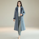 Angled view of women's double breasted winter overcoat