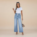 Angled view of women's wide leg denim jeans