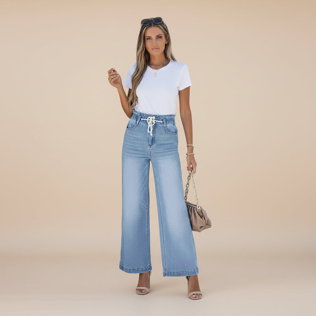 Angled view of women's wide leg denim jeans