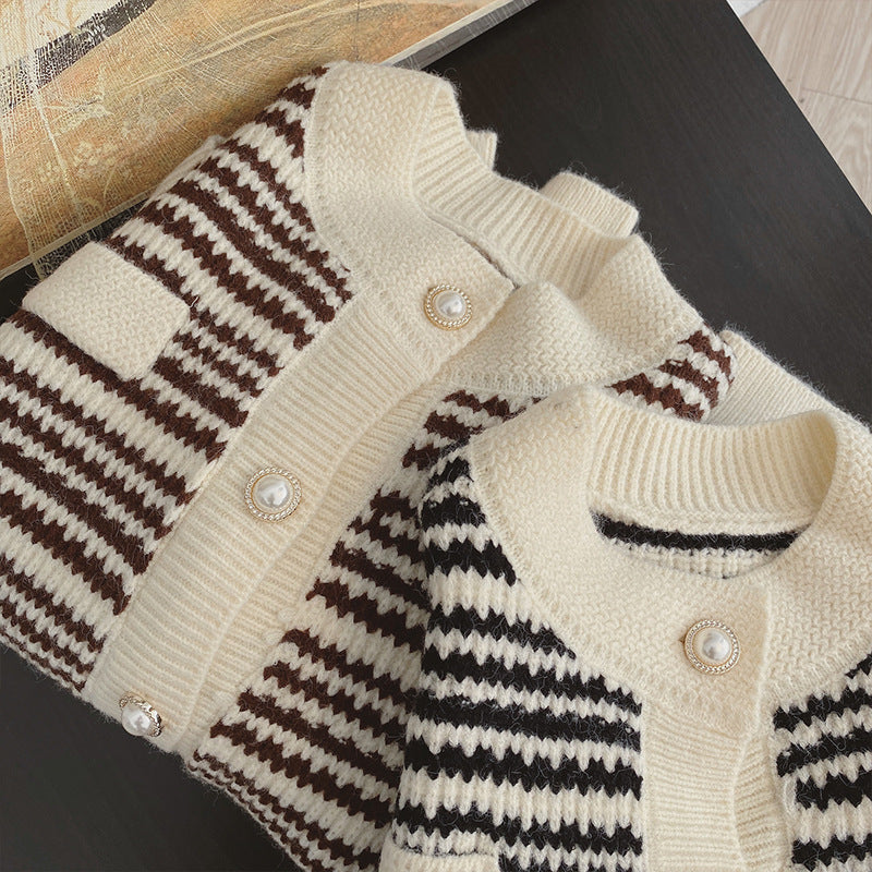 Knitted cardigans with striped pattern on a dark surface