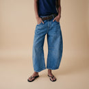 Women's baggy wide leg barrel denim jeans back view