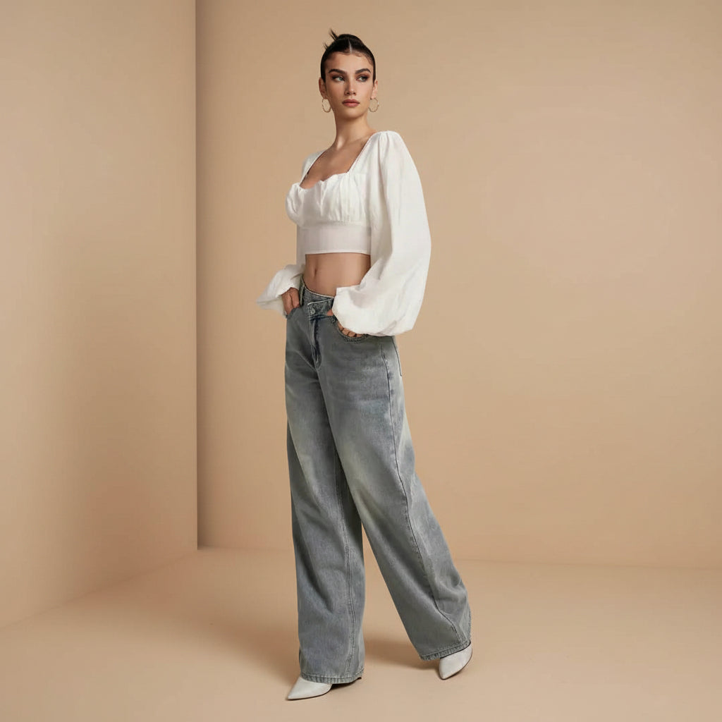 Women's mid rise loose fit flared denim trousers back view