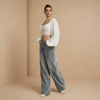 Women's mid rise loose fit flared denim trousers back view