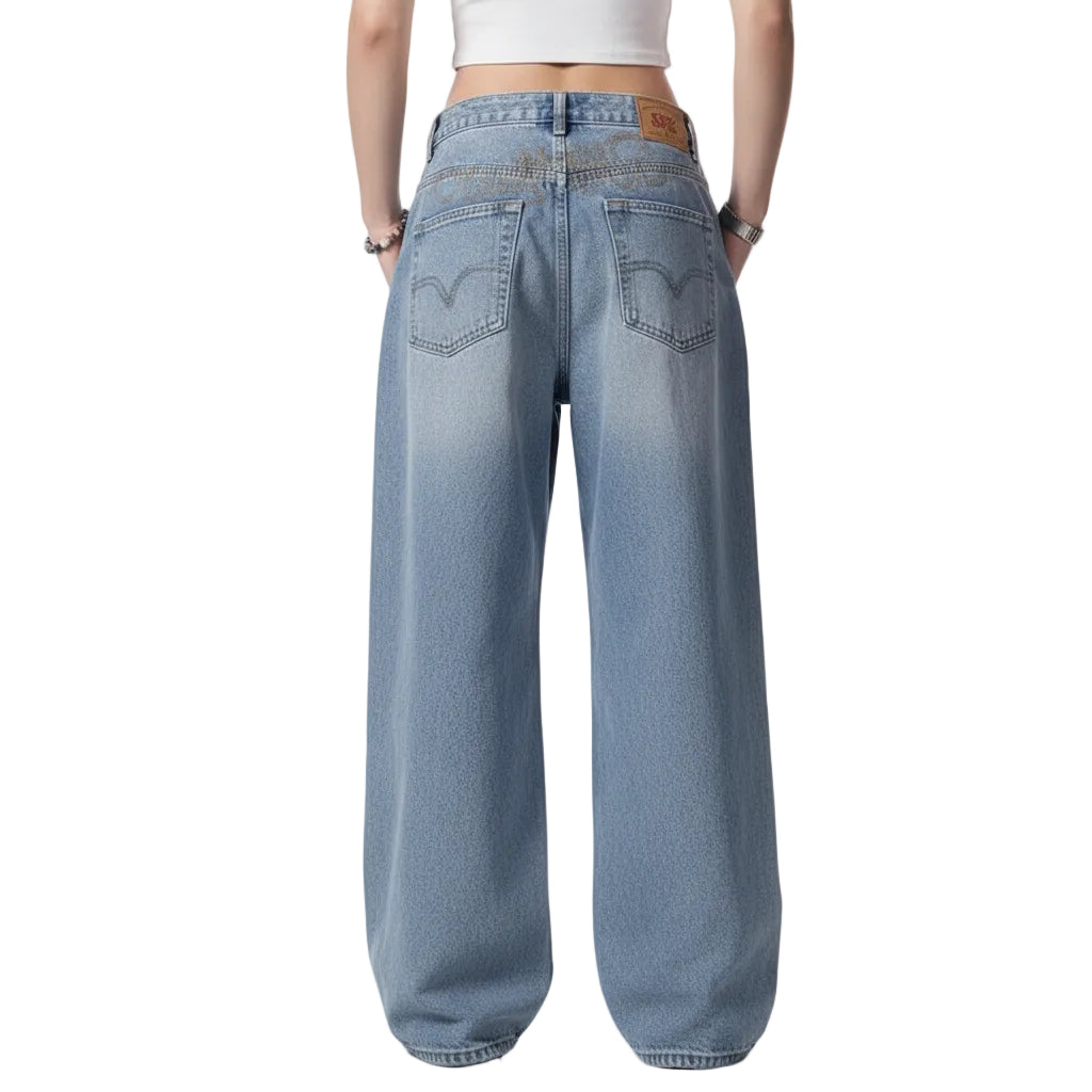 Blue jeans worn by a person on a white background