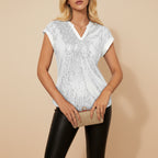 Angled view of women's sequin V neck blouse