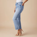 Angled view of women's washed distressed ripped denim jeans