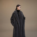 Women's wool long sleeve loose fit mid length winter overcoat left side view